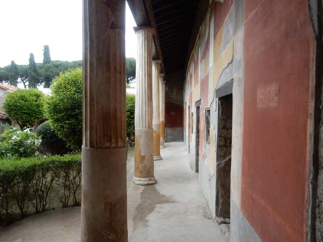 II.3.3 Pompeii. March 2009. Room 11, west portico, remains of painted panel, on south side of doorway to room 12.