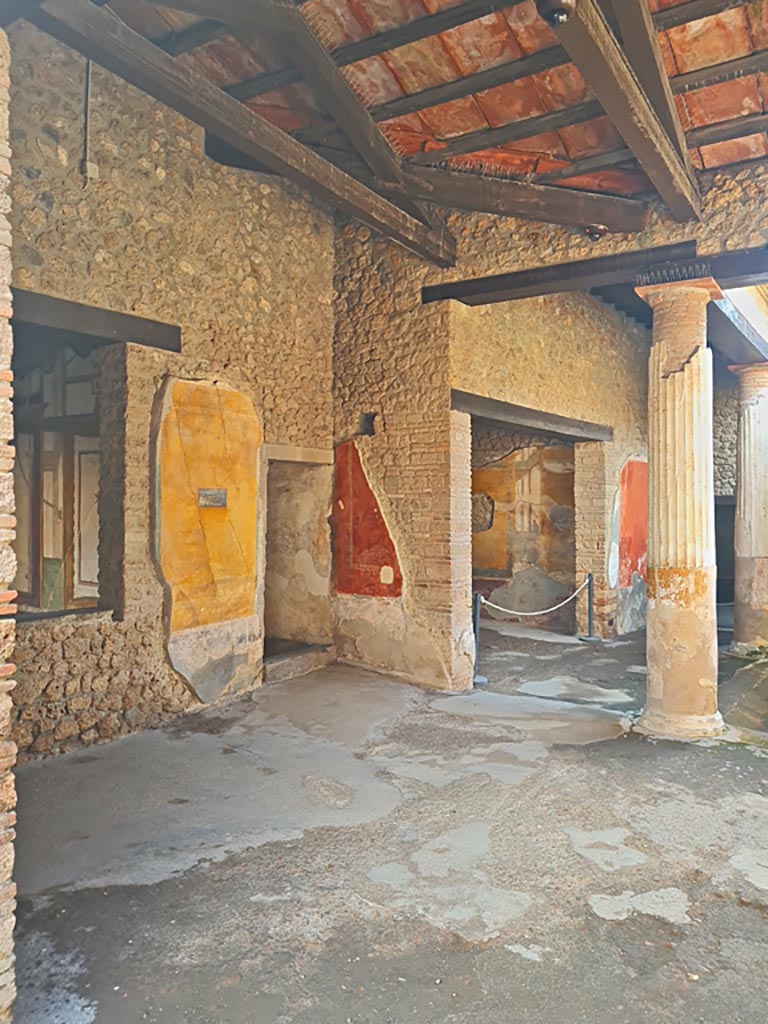 II.3.3 Pompeii. March 2024. Room 11, north-east corner, with doorways to rooms 8 and 9.
The window, on the left, is into room 4. Photo courtesy of Giuseppe Ciaramella.
