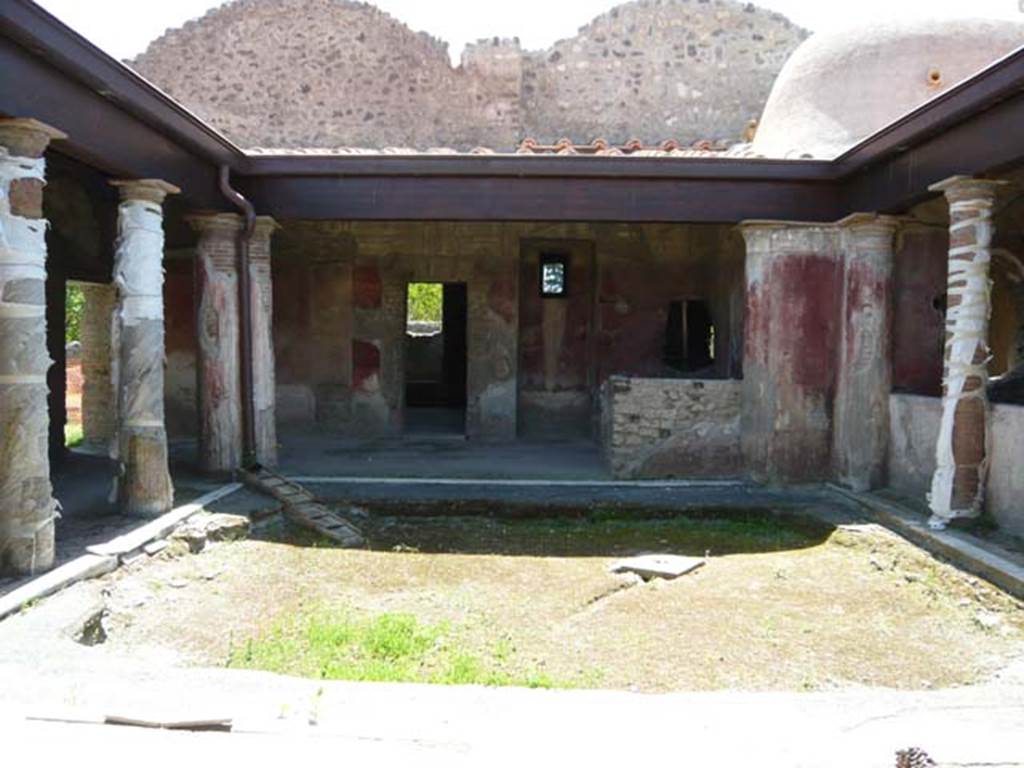 II.4.6 Pompeii. May 2012. Looking from entrance doorway to south side of portico.
Photo courtesy of Buzz Ferebee.