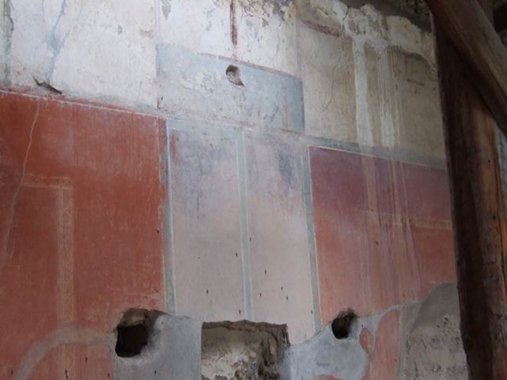 II.4.6 Pompeii. December 2006. Detail of wall decoration on north end of east wall.
According to PPM, the dark blue monochrome square topped by candelabrum, present in the upper white area, is a representation of a sacred landscape.
See Carratelli, G. P., 1990-2003. Pompei: Pitture e Mosaici: Vol. III. Roma: Istituto della enciclopedia italiana, p. 209.