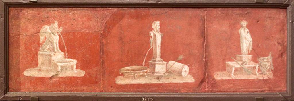 II.4.6 Pompeii. 3 separate frescoes with depiction of architectural fountains, united into one frame. Now in Naples Archaeological Museum. Inventory number 9275, described as being from Herculaneum. According to PPM, the separate vignettes of a Sphynx fountain (on left), and statue of a Philosopher (on right) would have been found in this front portico by the Bourbons, detached and sent to the Museum.
The vignette of the Herm used as a fountain, perhaps came from the atrium reached by entrance doorway II.4.10 and II.4.11, and from the south end of the west portico of the garden area.
See Carratelli, G. P., 1990-2003. Pompei: Pitture e Mosaici. Vol. III. Roma: Istituto della enciclopedia italiana. (p.212-3, no.43)