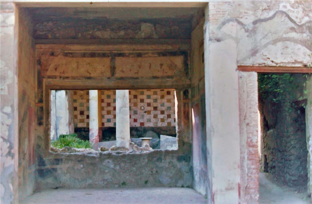 III.2.1 Pompeii, 7th August 1976. 
Looking north across tablinum to peristyle, with doorway to rear corridor and peristyle, on right.
Photo courtesy of Rick Bauer, from Dr.George Fay�s slides collection.
