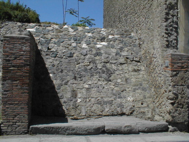 III.3.5 and 6 Pompeii. November 2010. Looking east along Via dell’Abbondanza, from near III.3.4 (pilaster on left).