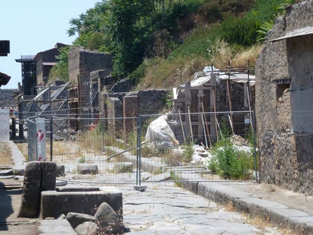 III.3.6 (centre) and III.4.1(on right) Pompeii. June 2012. Looking west along north side of Via dell�Abbondanza. Photo courtesy of Michael Binns. 
