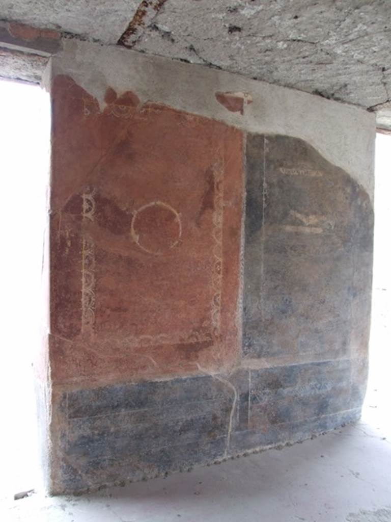III.4.3 Pompeii. March 2009. Room 3. Triclinium. Remains of painted panels on north wall, on east side of window, and near doorway.