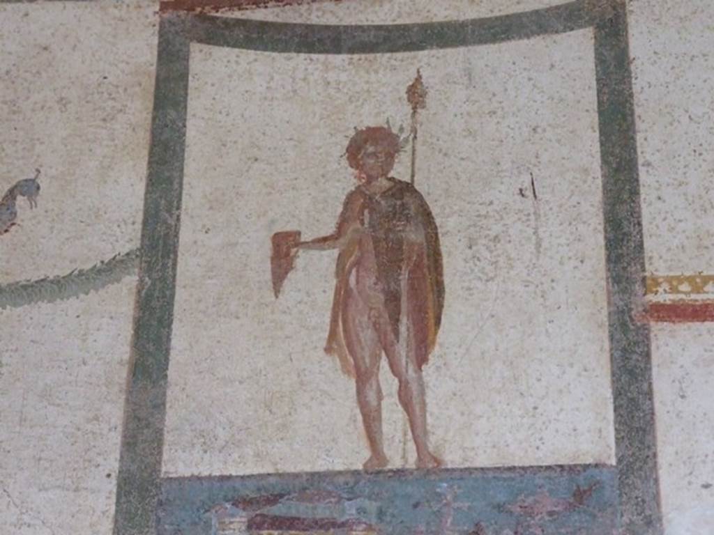 III.4.b Pompeii. March 2009. 
Room 4, upper north wall of anteroom/exedra. Painting of crowned figure with thyrsus and drinking horn.
According to Kuivalainen � 
�The pictorial programme as a whole and the posture of the youth support the identification as Bacchus, depicted half naked.�
See Kuivalainen, I., 2021. The Portrayal of Pompeian Bacchus. Commentationes Humanarum Litterarum 140. Helsinki: Finnish Society of Sciences and Letters, (p.94-95, B1).

