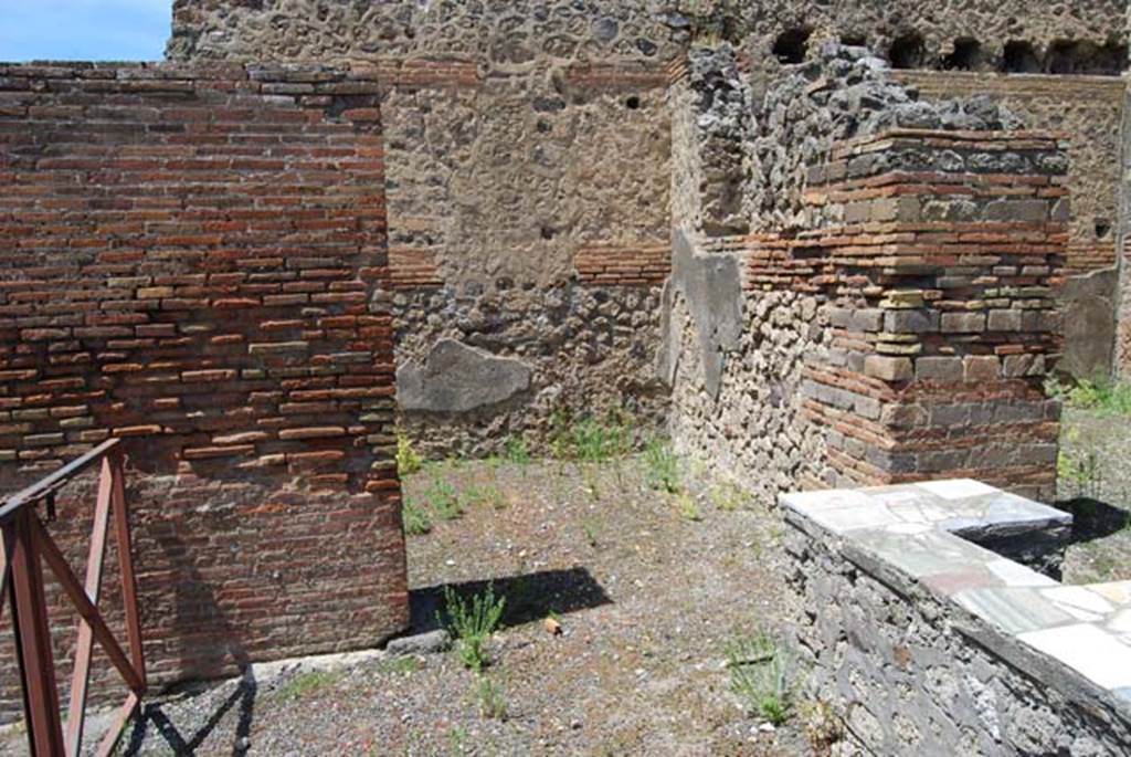 V.1.1 Pompeii. May 2013. Looking north from counter towards first rear room in north-west corner of bar-room, in centre. The window opening in its east wall is just visible, and the doorway to second room on north side can be seen on the right. Photo courtesy of Paula Lock.