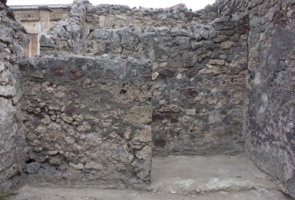 V.1.7 Pompeii. c.2005-7. Room “a”, north wall, with room 12, on right. Photo by Hans Thorwid.
Photo courtesy of Swedish Pompeii Project.