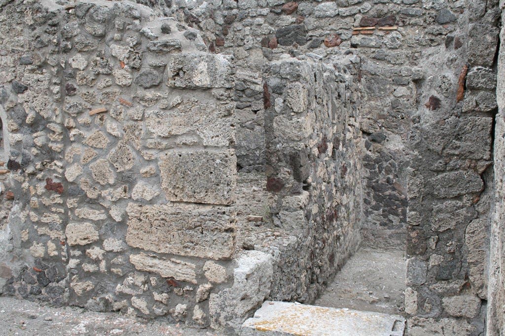 V.1.7 Pompeii. c.2005-7.
Room 12, looking towards doorway in south-east corner of peristyle “b”. Photo by Thomas Staub.
Photo courtesy of Swedish Pompeii Project.
