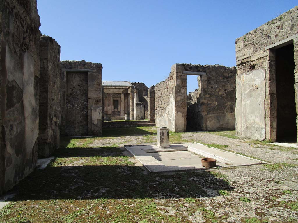 V.1.7, Pompeii. April 2019.
Looking north across atrium 4 towards doorway to room 13 tablinum, room 10 corridor, room 9 east ala, and room 8 cubiculum.
Photo courtesy of Rick Bauer.