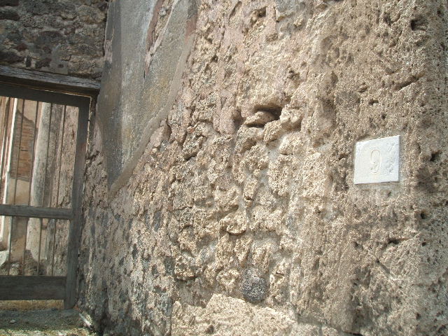 V.1.7 Pompeii. March 2009. Room on south side of Rear entrance fauces, with two doorways. Looking north.