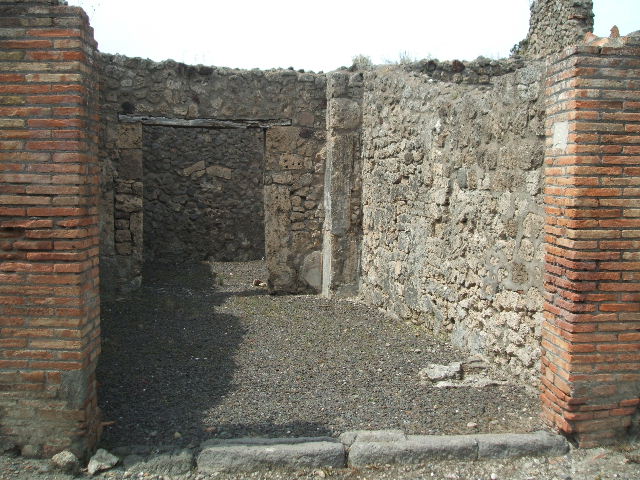 V.2.2 Pompeii.  March 2009. East wall of shop.