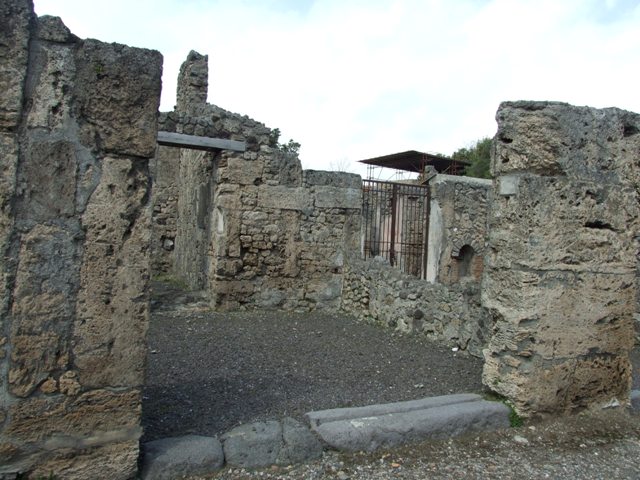 V.2.3 Pompeii.  March 2009.  Looking north across large caupona room, towards two rooms at rear.
