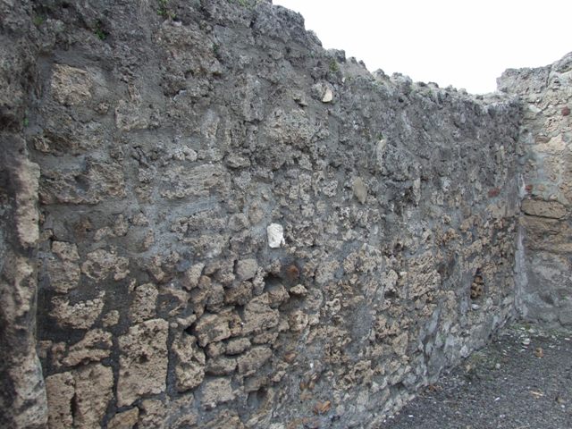 V.2.8 Pompeii. March 2009.  North wall of shop, with doorway to rear room.