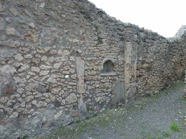 V.2.9 Pompeii. May 2010. Downpipe in east wall.