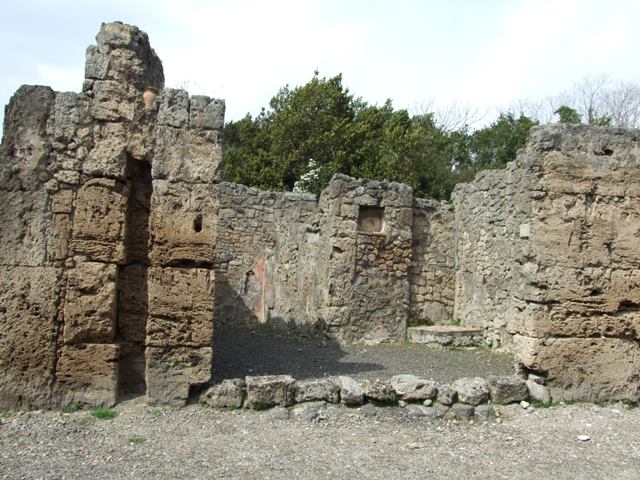 V.2.14 Pompeii. March 2009. East wall of shop with base for stairs to upper floor in north east corner.