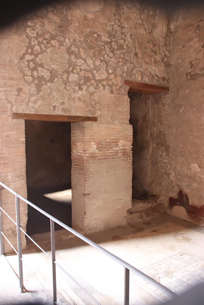 V.2.i Pompeii. October 2023.
Room 5, north end, with doorway to room 6, centre right. Photo courtesy of Klaus Heese.