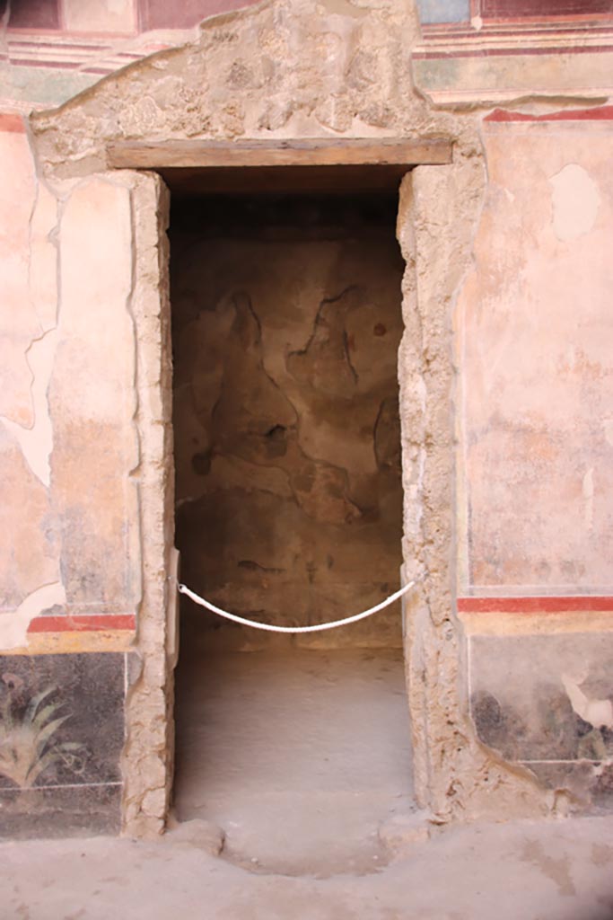 V.2.i Pompeii. October 2023.
Room 1, doorway to room 2b on west side of atrium. Photo courtesy of Klaus Heese.