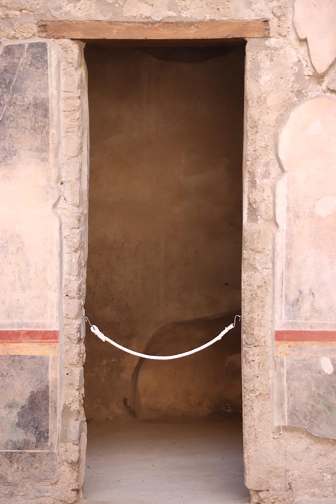 V.2.i Pompeii. October 2023. Room 1, doorway to room 2c on west side of atrium. Photo courtesy of Klaus Heese.