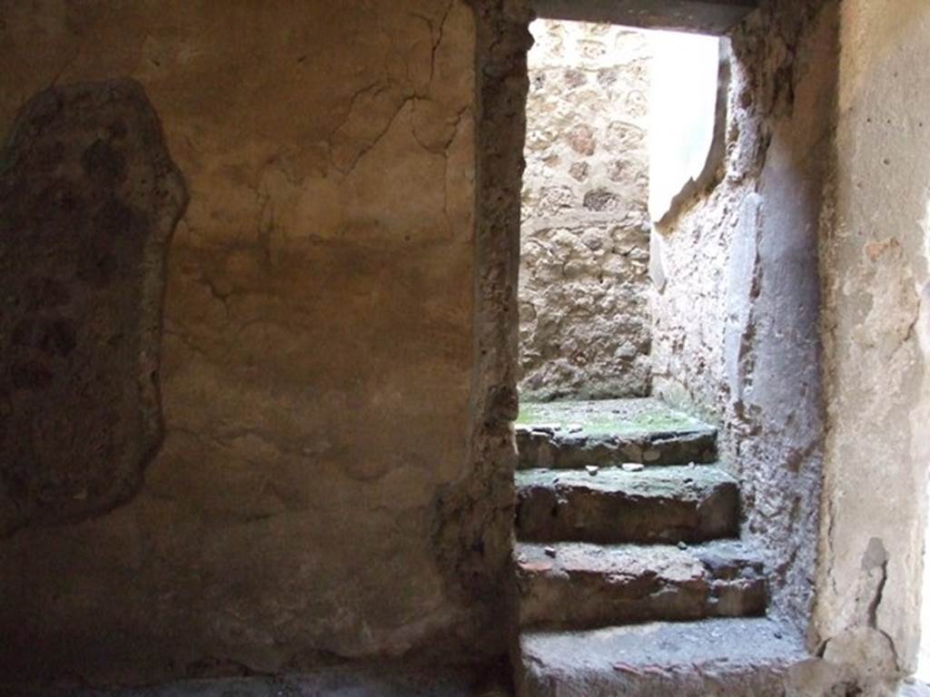 V.2.i Pompeii. March 2009. Room 2c, North wal with stairs to upper floorl.