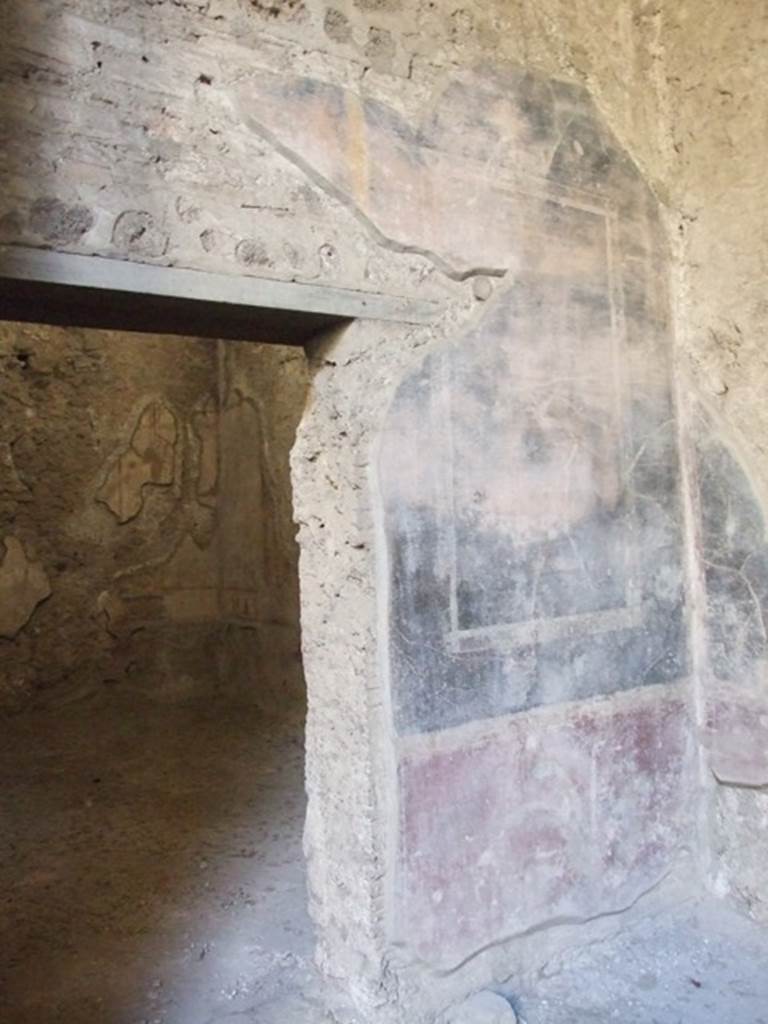 V.2.i Pompeii. December 2007. Room 8. Ala. Painted plaster on south wall at the side of doorway to room 9.
