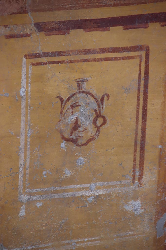 V.2.i Pompeii. October 2023.
Tablinum 7, detail from zoccolo with yellow panel on lower south end of west wall.
Photo courtesy of Klaus Heese.