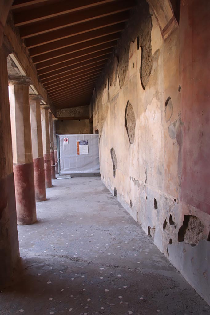 V.2.i Pompeii. October 2023.
Looking along west wall of west portico from south end of Corridor 10. Photo courtesy of Klaus Heese.