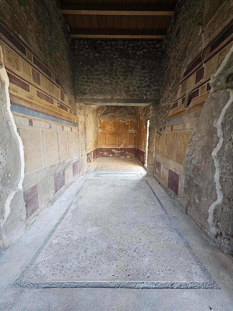 V.2.i Pompeii. November 2024.
Room 14, looking west across flooring of antecamera towards apodyterium or dressing room.
Photo courtesy of Annette Haug.