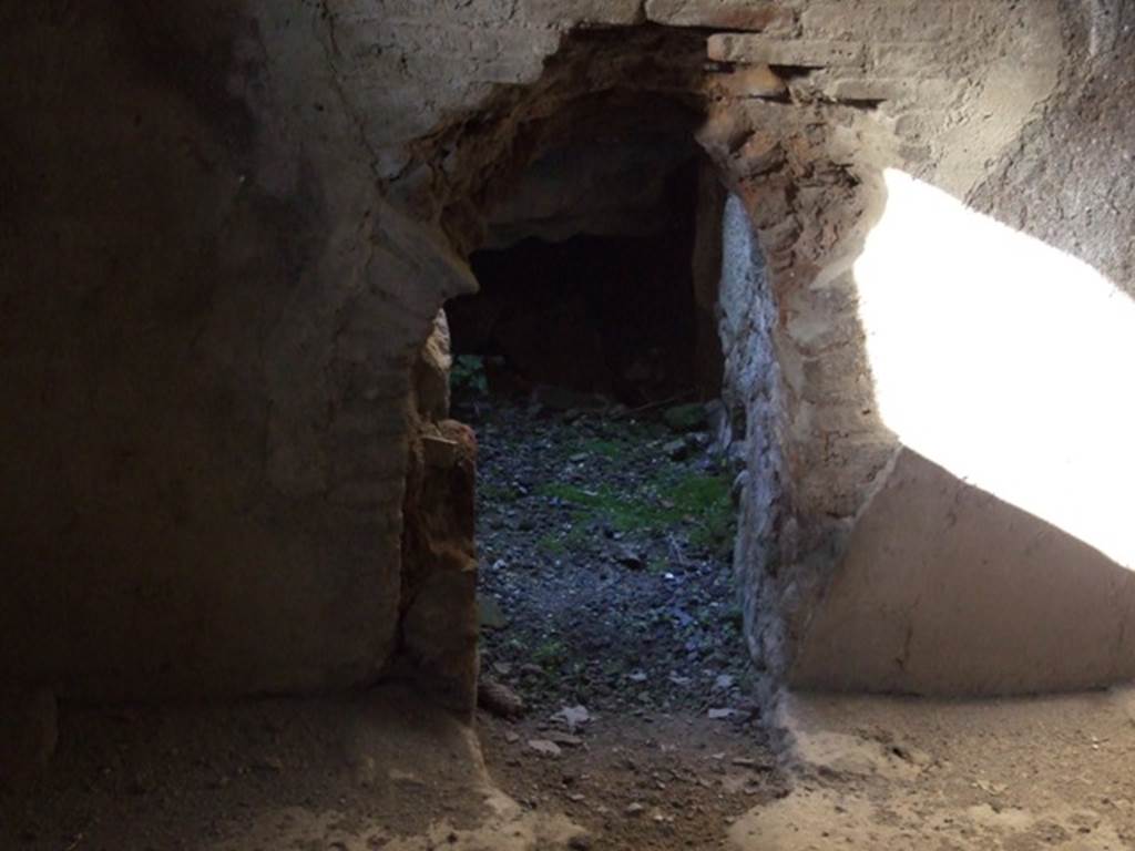 V.2.i Pompeii. December 2007. Room 16, north wall of caldarium. Looking north into the hole in the floor and wall of the kitchen area.