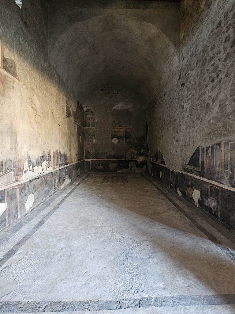 V.2.i Pompeii. November 2024.
Room 17, looking west into oecus/triclinium from doorway from west portico. Photo courtesy of Annette Haug.