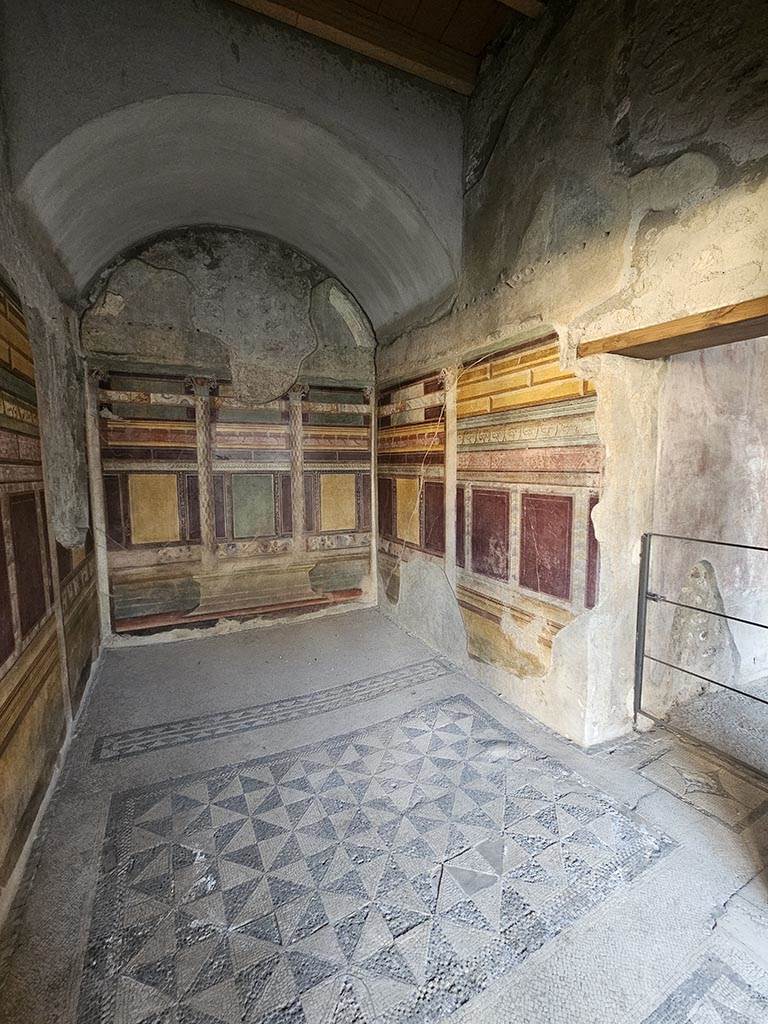 V.2.i Pompeii. November 2024.
Room 18, looking towards south wall, south-west corner and west wall. Photo courtesy of Annette Haug.