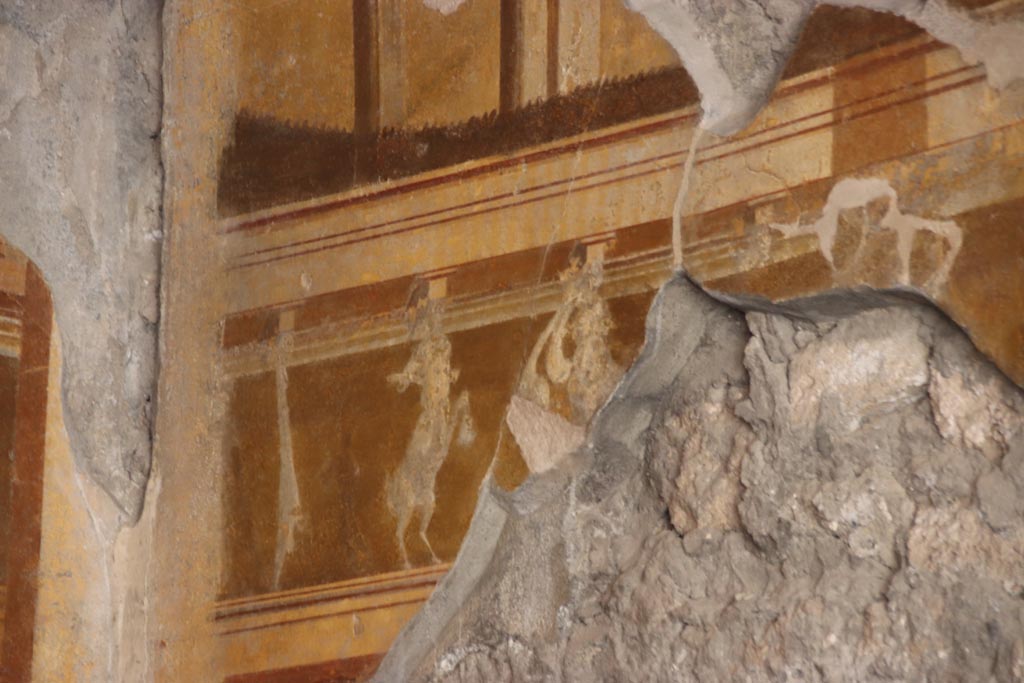 V.2.i Pompeii. October 2023. Room 19, detail from upper west wall at south end. Photo courtesy of Klaus Heese.