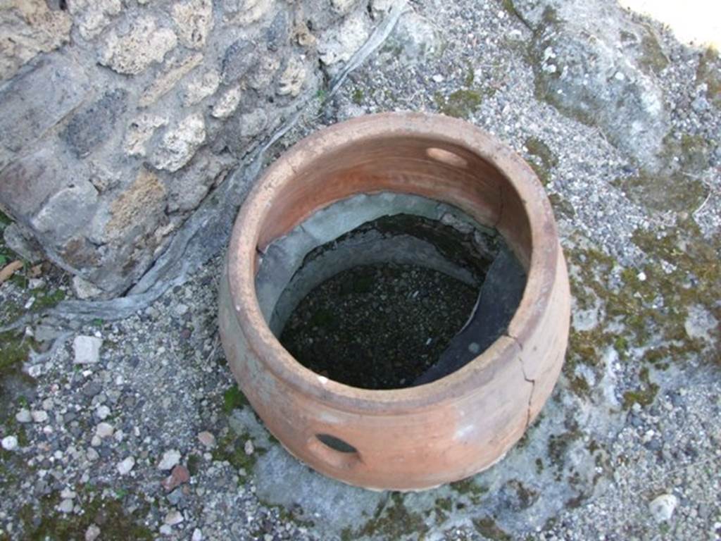 V.3.6 Pompeii. March 2009. Dolium used as puteal over cistern mouth near north wall of Shop room.