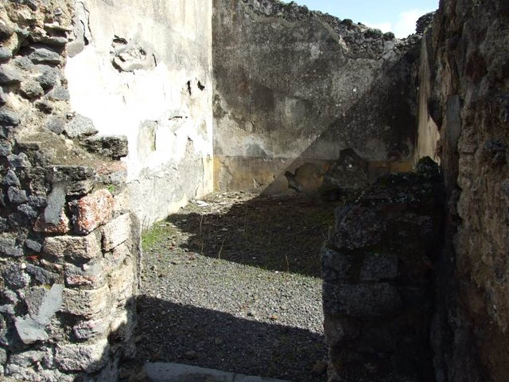 V.4.3 Pompeii. March 2009.  Doorway to triclinium on east side of atrium, with small room or cupboard. Looking east. According to Boyce, items were found among the ruins of two cupboards in the room to the east of the atrium. Together with a hoard of 130 silver and 54 bronze coins, also found were three bronze statuettes of the household gods. The Genius, and two Lares each holding cornucopia and patera and standing solidly on two feet. A marble statuette of Venus Anadyomene and a small marble altar may also have belonged to the shrine. He quoted Notizie degli Scavi di Antichit�, 1899, 206. See Boyce G. K., 1937. Corpus of the Lararia of Pompeii. Rome: MAAR 14. (p.40, no.118, note 1). See Giacobello, F., 2008. Larari Pompeiani: Iconografia e culto dei Lari in ambito domestico.  Milano: LED Edizioni. (p.240). According to Sogliano, these were found in the room that opens on the east side of the atrium on 9th May 1899. They are listed in Notizie degli Scavi, 1899, (pages 203-208).