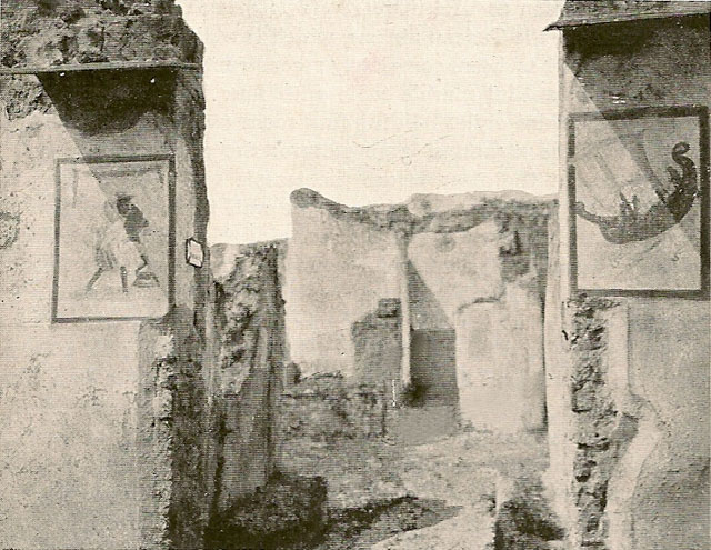 V.4.13 Pompeii. Found on the left entrance pillar. Painting of Mercury, with serpent coiling around an omphalos at his feet.