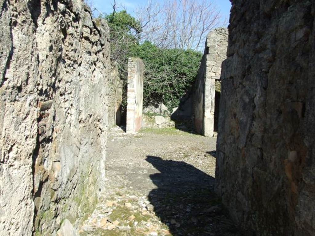 V.4.c Pompeii. March 2009. Looking east across room A, the fauces, towards atrium and tablinum.
According to NdS, (1902) �
In the house in Reg. V that had its doorway opposite to the one at V.3.11 (therefore V.4.c), I verify that on the 1st May, an important discovery was made of 4 skeletons with the following objects �
Large gold bracelet in the shape of facing serpents;
Two gold rings set with stone;
A pair of earrings;
One aureus of Nero, and two of Domitian;
29 silver coins, silver bronze mirror

The death of the unfortunates would have seemed to have been from the fire that caused the floor of the upper room, where they had taken refuge, to collapse, and whose violence had partly burnt their bones and left traces on the paintings on the walls.

The house, to judge from the part excavated up until now, will not have been very large, nor as beautiful as the one opposite to it (V.3.11). 
However, it had in the tablinum fairly good paintings showing the four seasons (Autumn completely disappeared, and in the atrium was a painting of Mercury with purse and staff/caduceus, very similar to the one existing in the thermopolium V.4.6-7 (see Notizie1899, p. 343) however, �ours� had a large serpent curled/tangled at his feet.
R.PARIBENI.
See Notizie degli Scavi, 1902, (p.276).
