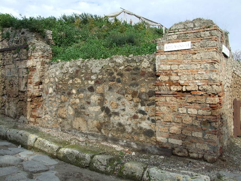 V.6.1 Pompeii. December 2006. Photo showing entrance to shop.  The pillar on the right used to have a painting of Bacchus.  The pillar on the left used to have a painting of Mercury.  See Fr�hlich, T., 1991, Lararien und Fassadenbilder in den Vesuvst�dten.  Mainz: von Zabern.  (F34: p.318).  According to Garcia y Garcia, the loss of these paintings was attributable to the bomb that fell in the road here on the night of 16 September 1943. The paintings were photographed at the time of Sogliano, around 1906, and also by Tatiana Warscher, pre 1943. 
These can be seen in Garcia y Garcia, L., 2006. Danni di guerra a Pompei. Rome: L�Erma di Bretschneider. (p. 66).
