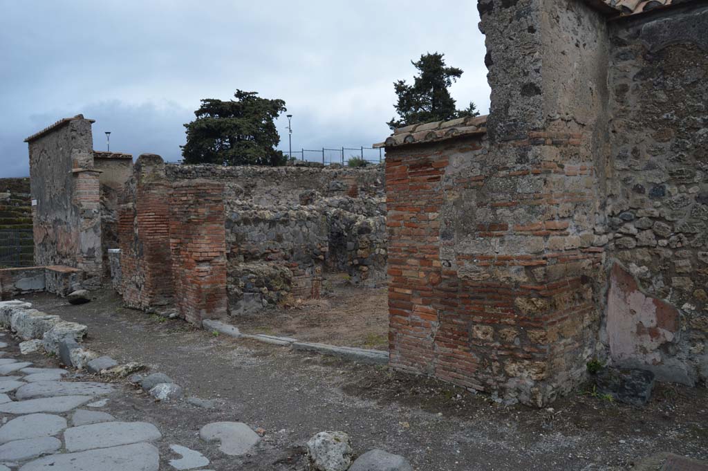 VI.1.4 Pompeii. March 2019. Looking north-east on Via Consolare to entrance doorway, in centre and towards VI.1.2, on left. 
Foto Taylor Lauritsen, ERC Grant 681269 D�COR.
