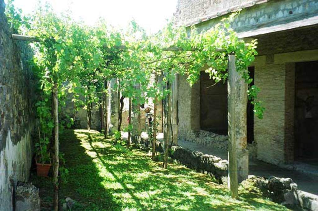 VI.2.4 Pompeii. June 2010. Looking south across garden, from garden summer triclinium.
Photo courtesy of Rick Bauer.