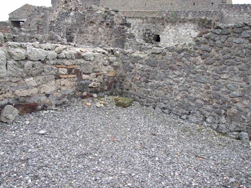 VI.2.10 Pompeii. December 2007. Latrine on east side of kitchen. According to Hobson, this shows the slots in the side walls together with the plastering covering the three walls down to the level of the seat. He thought that this showed that this latrine may have been at least comfortable, and may even have had decoration on the wall plaster. See Hobson, B., 2009. Latrinae et foricae: Toilets in the Roman World. London; Duckworth. (p.49)
