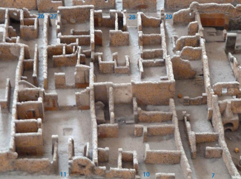 VI.2.11 Pompeii, can be seen on the left. May 2010. Looking east. Model as viewed in Naples Archaeological Museum. According to the model, at the rear of the atrium was a window overlooking the garden of house at VI.2.26. According to Fiorelli, this had a gate of iron and wood. See Pappalardo, U., 2001. La Descrizione di Pompei per Giuseppe Fiorelli (1875). Napoli: Massa Editore. (p.50)