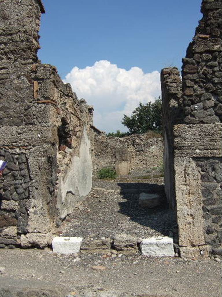 VI.2.12 Pompeii. September 2005. Room 1. Looking east through fauces and across atrium to tablinum.