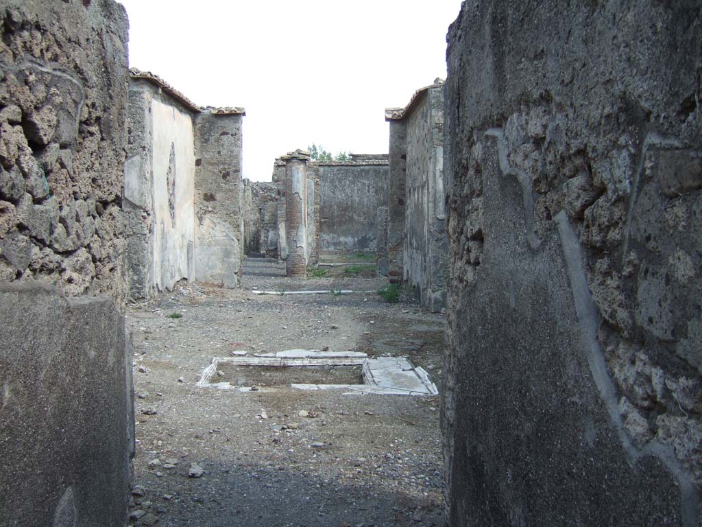 VI.2.16 Pompeii. May 2010. Looking east from rear entrance in Vicolo di Narciso. Model as viewed in Naples Archaeological Museum.
