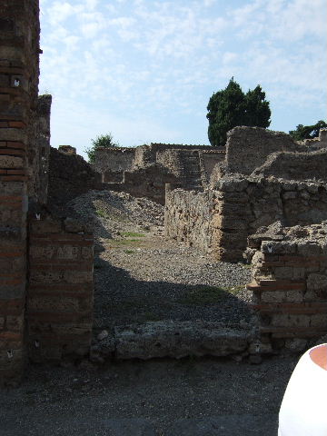 VI.2.20 Pompeii. September 2005. Looking north west towards stone staircase.