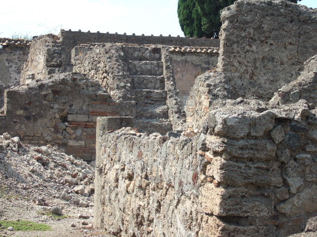 VI.2.20 Pompeii. September 2005. Excavation at base of street wall between VI.2.19 and VI.2.20.