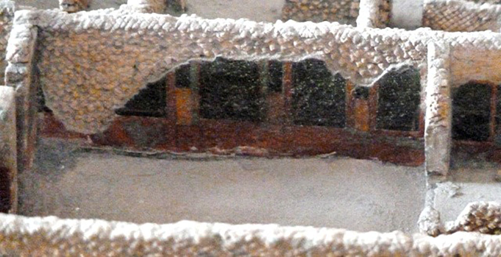 VI.2.22 Pompeii. December 2007. The base of the aedicula niche was painted red. The projecting ledge had three bands of stucco ornament , and two tall fluted columns rested on it. They supported the pediment. The columns and the pediment are now all vanished. See Boyce G. K., 1937. Corpus of the Lararia of Pompeii. Rome: MAAR 14.(142, p44).  

