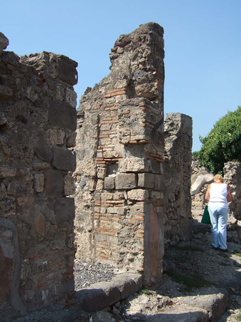 VI.2.29 Pompeii. September 2005. Looking south to steps to upper floor, immediately to west of entrance doorway.