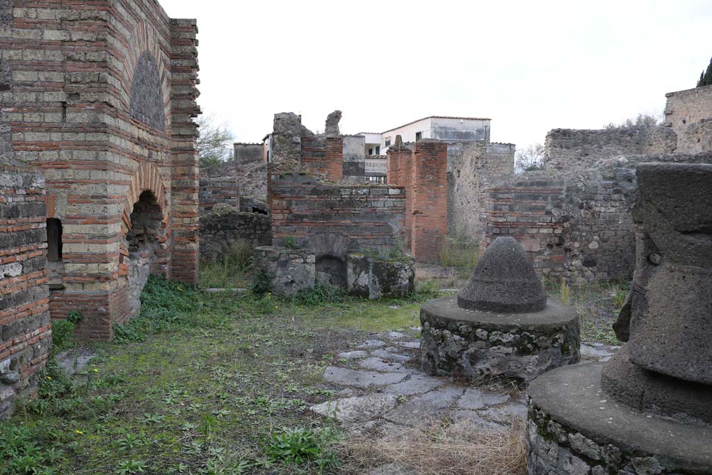 VI.3.3 Pompeii. December 2018.
Room 7, looking west across south side of mill-room towards doorways to rooms 5 and 4. Photo courtesy of Aude Durand.