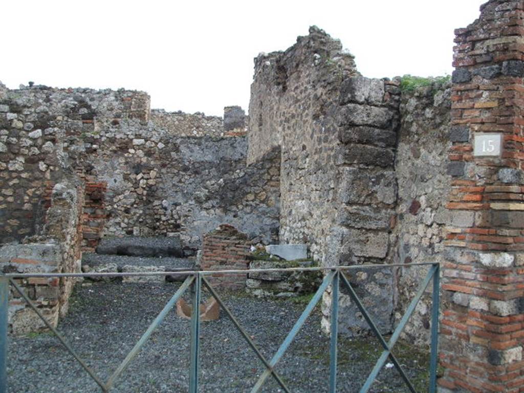 VI.3.15 Pompeii. December 2004. Looking east from Via Consolare.
According to CTP, CIL IV 108 was found here. Howvere, they say Zangemeister located it on the west side (left) of VI.3.20. See Van der Poel, H. B., 1983. Corpus Topographicum Pompeianum, Part II. Austin: University of Texas. (p.249) According to Epigraphik-Datenbank Clauss/Slaby (See www.manfredclauss.de), it read � C(aium) I(ulium) P(riscum) IIvir(um)

On the left can be seen the rear room of the shop, possibly a cubiculum.
On the right near the terracotta remains of a puteal, remains of another room with steps. In the area behind the steps would have been the latrine In the middle a corridor to the rear. At the rear would have been another room, a triclinium or workshop?.  See Eschebach, L., 1993. Geb�udeverzeichnis und Stadtplan der antiken Stadt Pompeji. K�ln: B�hlau. (p.164) See Pappalardo, U., 2001. La Descrizione di Pompei per Giuseppe Fiorelli (1875). Napoli: Massa Editore. (p.53)

