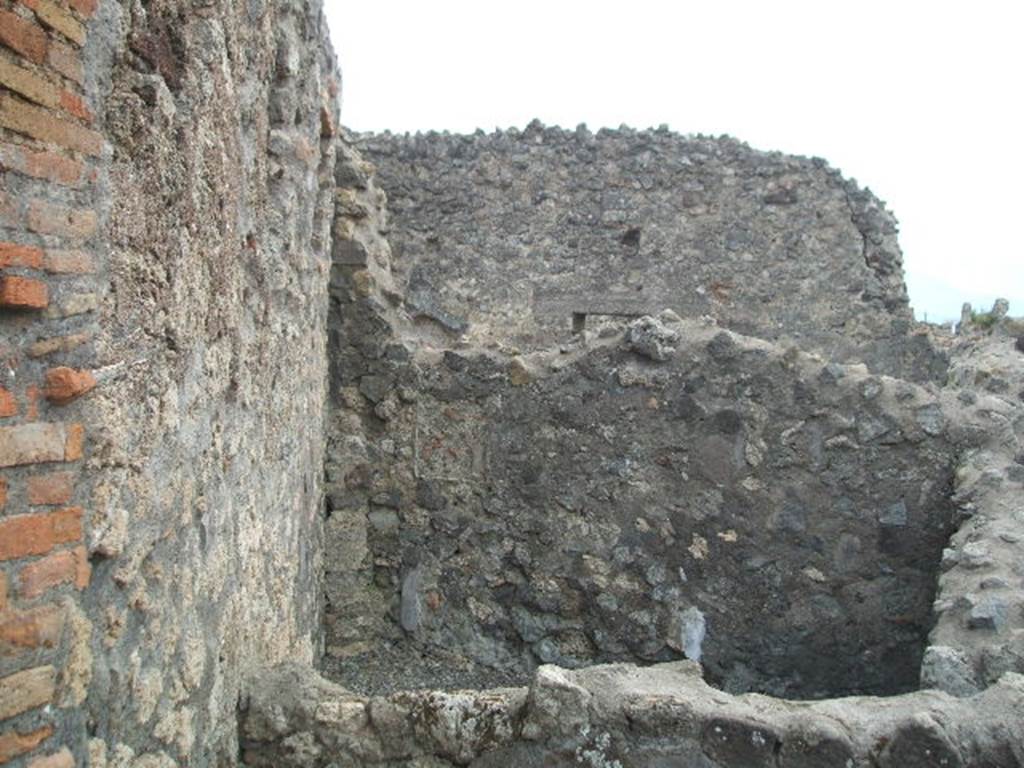 VI.4.1 Pompeii. May 2005. Looking south from entrance at VI.4.2, towards rear room, possibly a cubiculum of VI.4.1.


